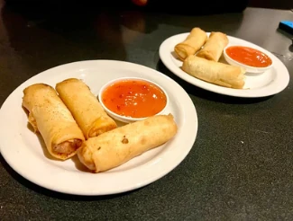 Golden spring rolls with dipping sauce